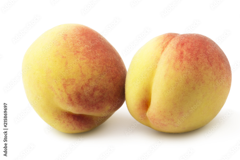 Freshly picked peaches close-up on a white background Freshly picked peaches close-up on a white background