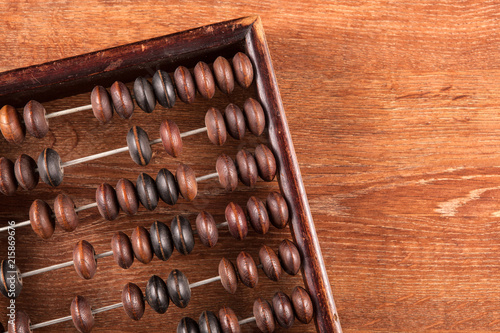 antique abacus on a wooden table as a background top view