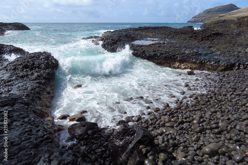 Wild waves crashing on the rocky shoreline near Kalapaki Beach, Kauai, Hawaii