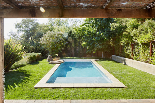 Small pool in backyard of home in California photo
