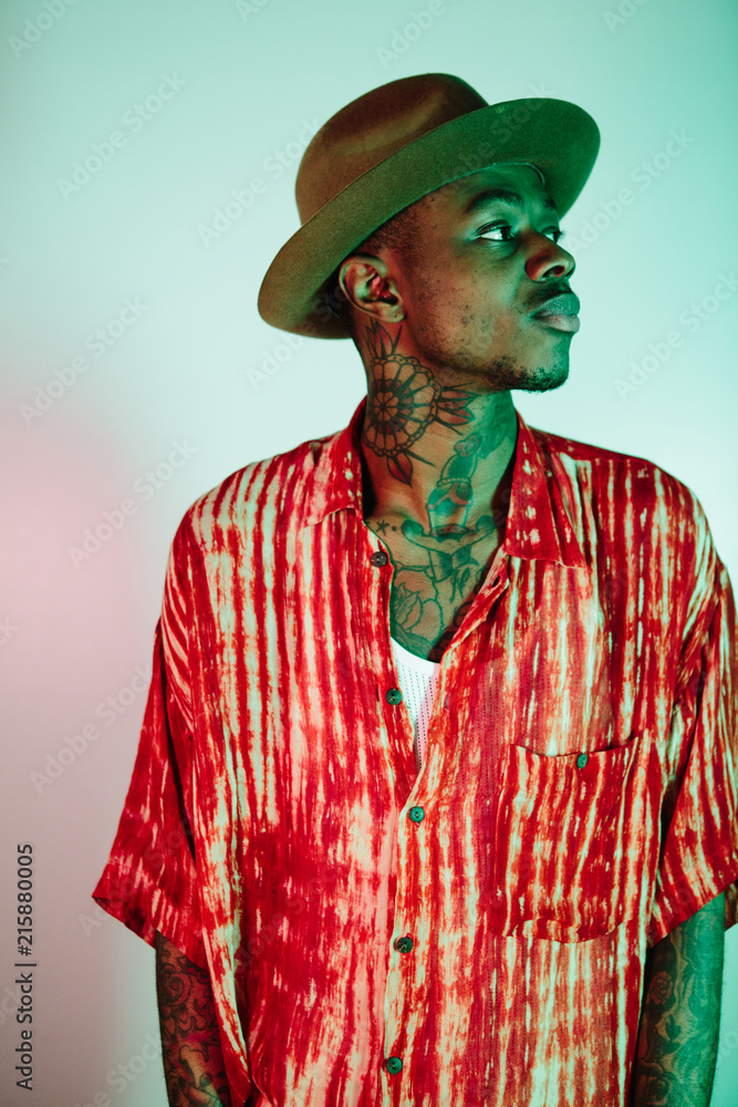 Stylish tattooed man wearing red shirt Stylish tattooed man wearing red shirt