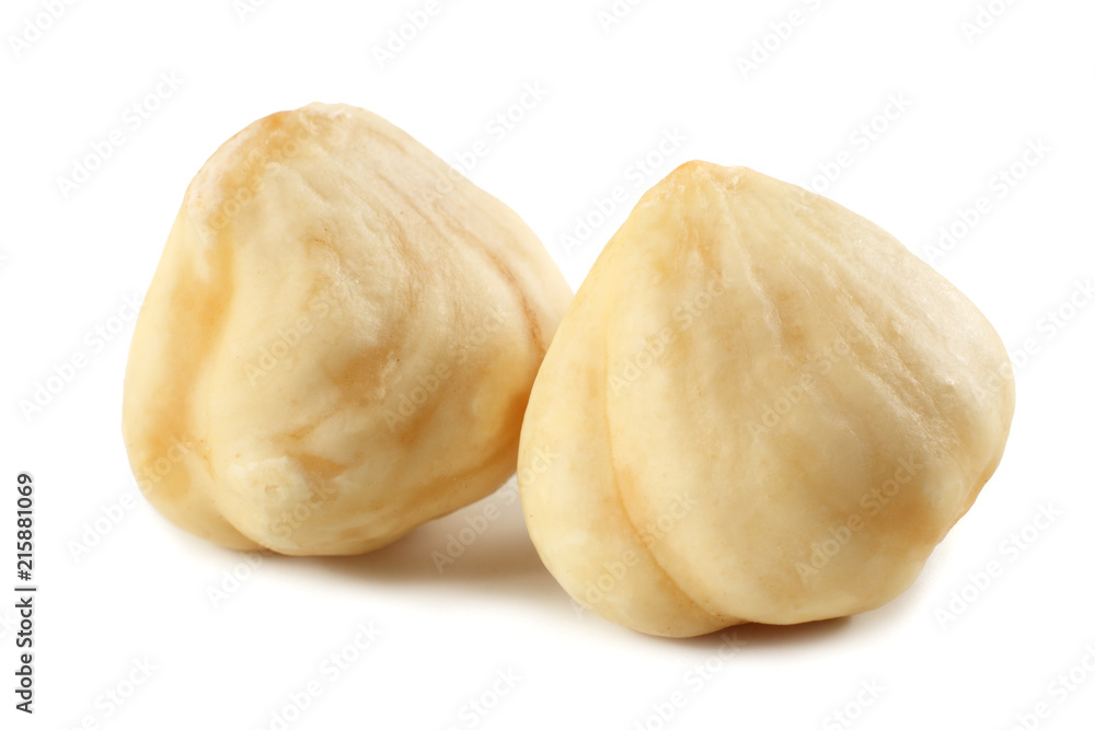 Fototapeta premium two hazelnuts isolated on a white background. macro