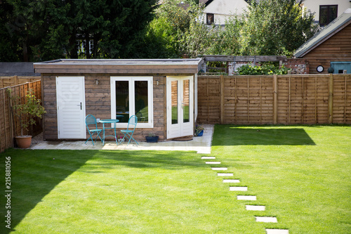 Timber home office building in a suburban garden