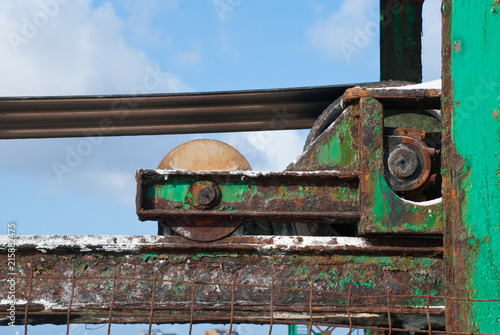 Old rust equipment for transportation and distribution. Industrial elevator.Machine background. photo