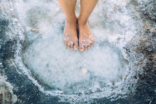 Feet in salt puddle
