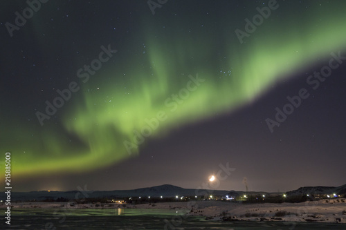 Wallpaper Mural Northern lights and the setting moon in Selfoss, Iceland Torontodigital.ca