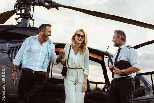 Loving couple traveling by their helicopter