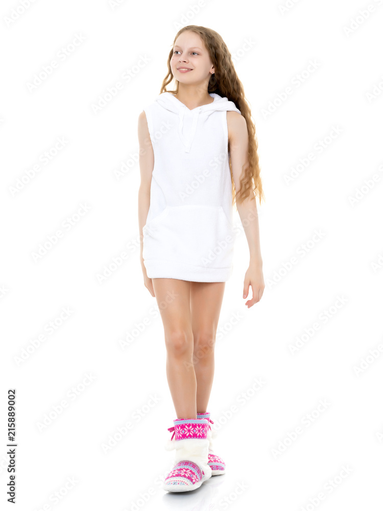 Fototapeta premium Emotional little girl in a clean white T-shirt.