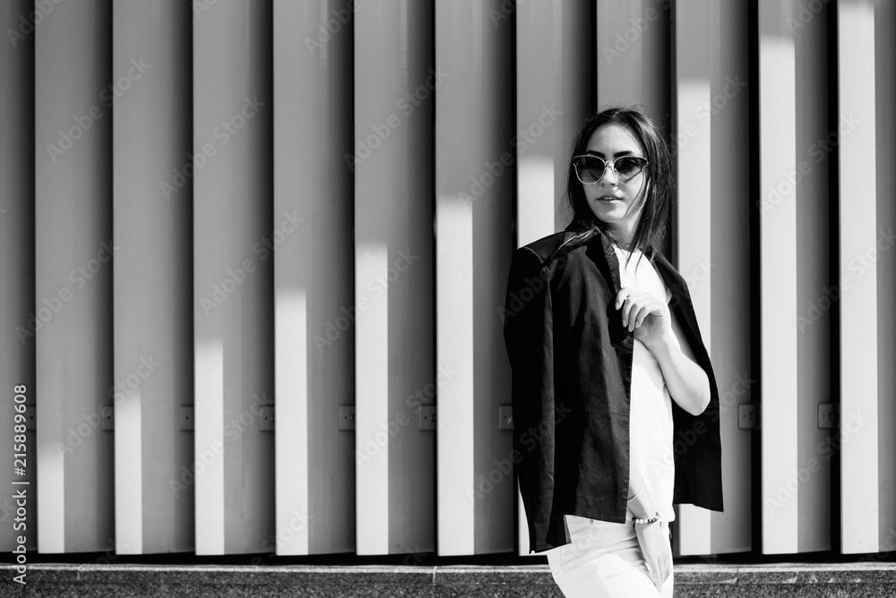 The young pretty girl is actively spending time on the street The young pretty girl is actively spending time on the street