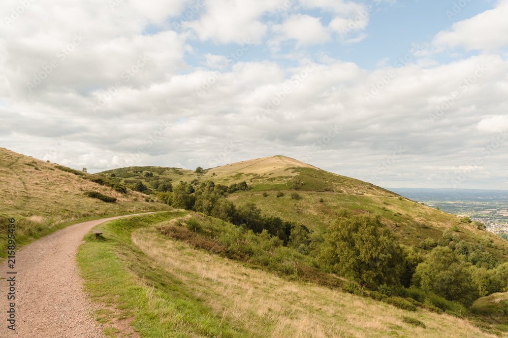 An empty path across a hill range An empty path across a hill range