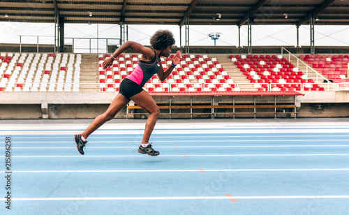 Black athlete woman on a race track photo