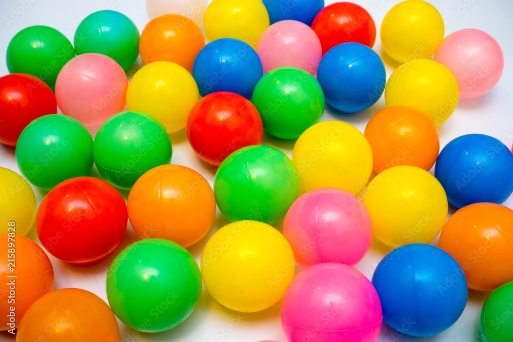 colorful plastic balls on a white background colorful plastic balls on a white background