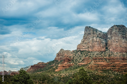 Dramatic butte in Sedona with dramatic storm clouds overhead 