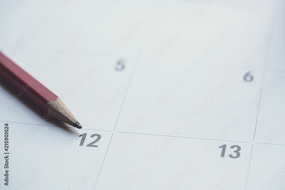 close up of organizer or calendar and red pencil, planning for business meeting or travel planning concept close up of organizer or calendar and red pencil, planning for business meeting or travel planning concept