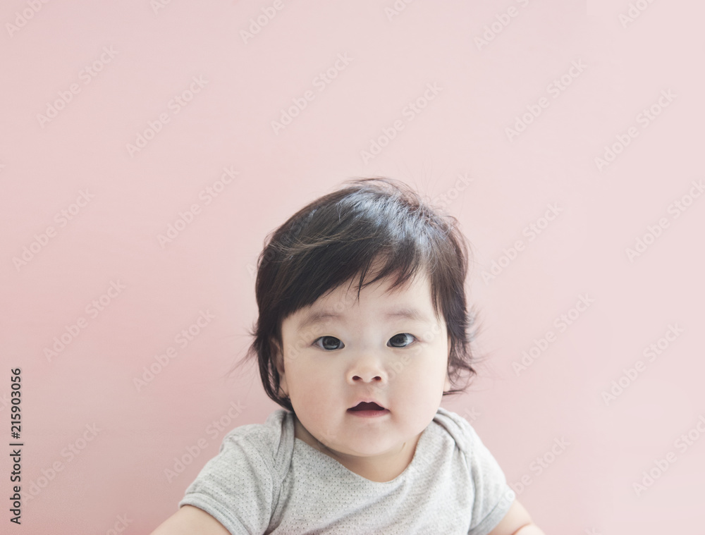 Cute little baby girl with pink background Cute little baby girl with pink background