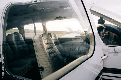 Closeup of Small Charter Plane Cockpit With Leather Seats photo