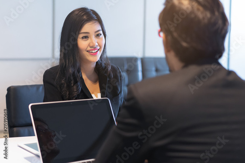 Asian woman answering question interview during job application.