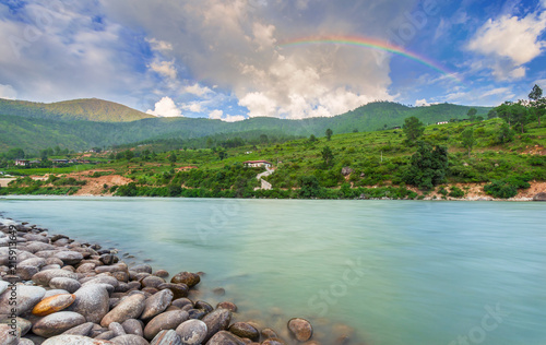 Paro Chuu River on a Nice Day with Rainblow on the Sky in Paro city, Bhutan photo