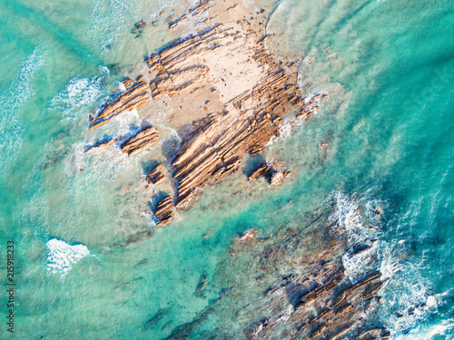 Rocks being swallowed up by the ocean