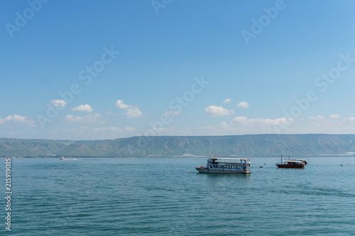 Old boat on Sea of Galilee in Israel at foggy spring day. © olegmayorov