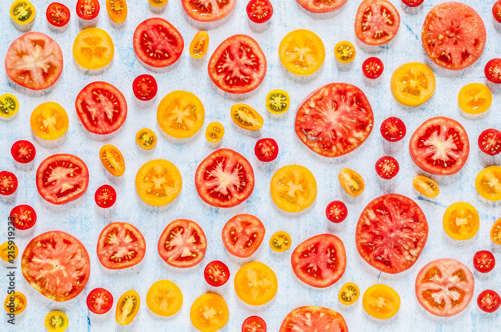 Slices of Tomatoes Over Blue Background Slices of Tomatoes Over Blue Background