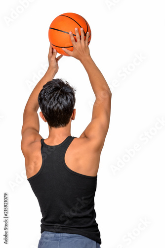 Teenager  with sportswear playing basketball. White background.