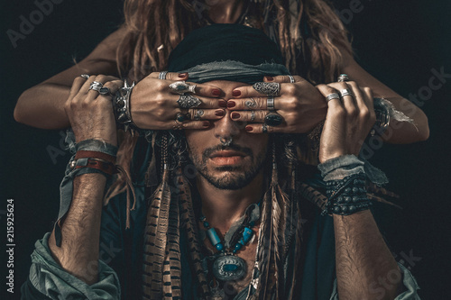 Fototapeta stylish fashionable young handsome man and woman covering his eyes with hands