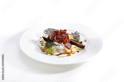 Delicacy cuisine served on round shaped plate