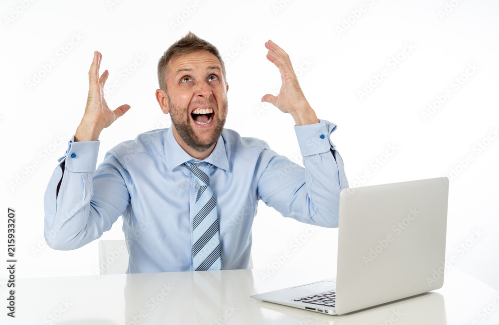 Business, people, deadline and technology concept - stressed entrepreneur businessman with laptop computer at office feeling angry and desperate. Business, people, deadline and technology concept - stressed entrepreneur businessman with laptop computer at office feeling angry and desperate.