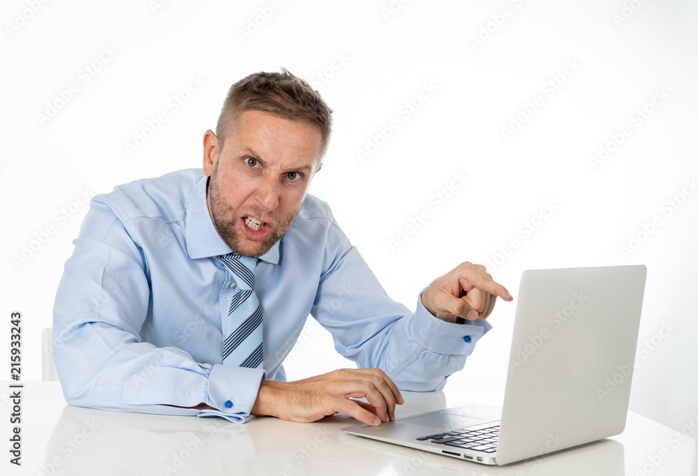 Business, people, deadline and technology concept - stressed entrepreneur businessman with laptop computer at office feeling angry and desperate. Business, people, deadline and technology concept - stressed entrepreneur businessman with laptop computer at office feeling angry and desperate.