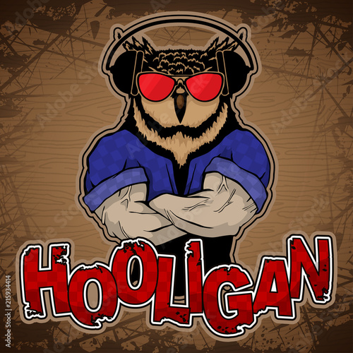 Steep fashionable owl on a wooden background.