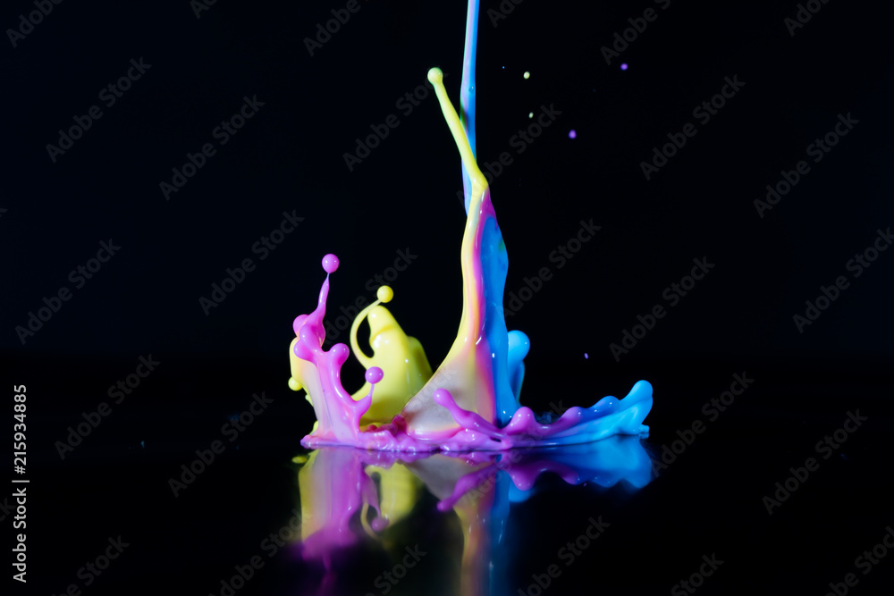 Obraz premium Dancing color ink on black background
