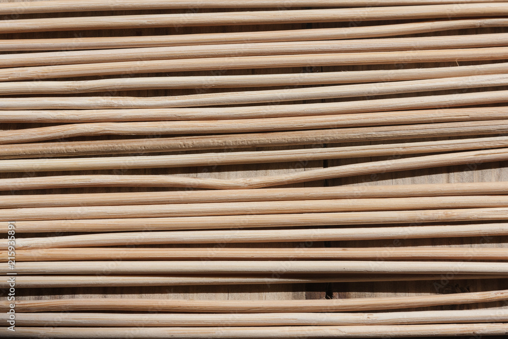 Wooden sticks of non-uniform shapes arranged parallel to each other creating an interesting background. Wooden sticks of non-uniform shapes arranged parallel to each other creating an interesting background.