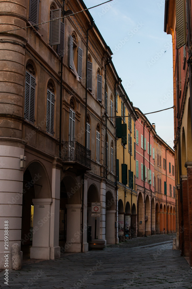 Classic old buildings in a street of a town in Italy.
