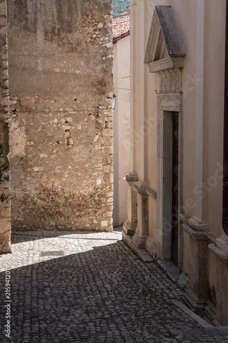 Sun light on a medieval town alley. © Alessandro Vecchi