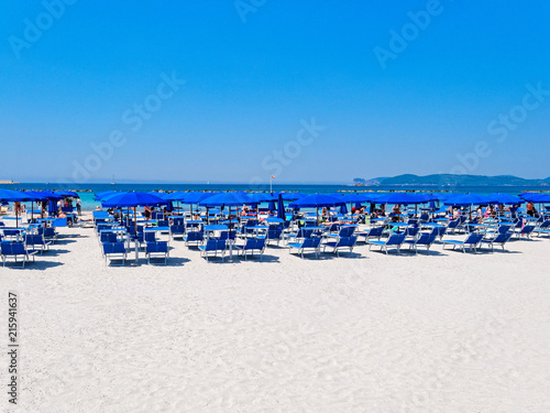 Alghero beach. Sea view, umbrellas and sun loungers. Sardinia, Italy. © Karol