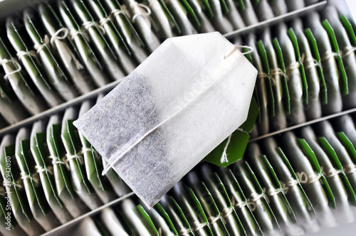 Tablou pe pânză Green tea bag lying on a box with other tea bags
