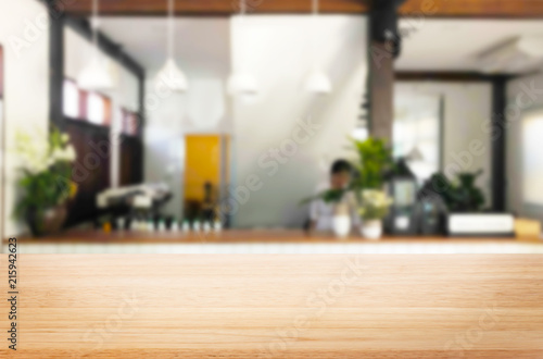 Selected focus empty brown wooden table and Coffee shop or restaurant blur background with bokeh image. for your photomontage or product display