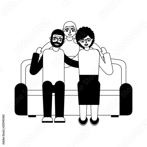 grandparents with grandson sitting on sofa