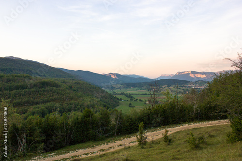 Landscape with valley and hiking trail in the sunset, Vercors, France