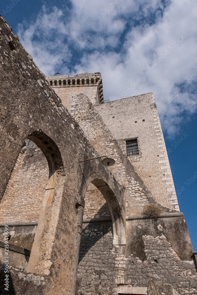 Arches of an stone old castle with blue sky and clouds background. Arches of an stone old castle with blue sky and clouds background.