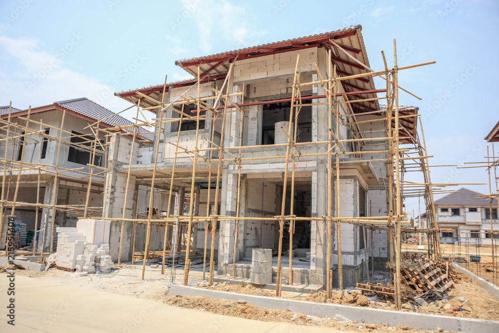 house under construction with autoclaved aerated concrete block structure at building site