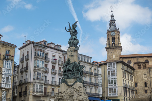 Monument and church in the Virgen Blanca square in Vitoria, Spain. photo