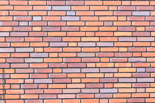 Brick wall background texture close up, colorful bricks
