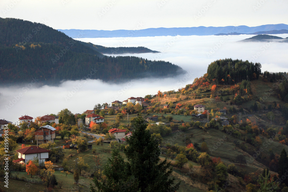 Autumn in the Rhodope Mountains, Bulgaria. Early morning. The mountain is covered with fog.