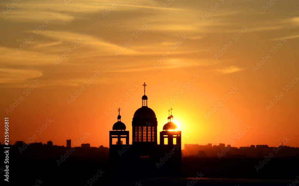 Silhouette of the church building at sunset