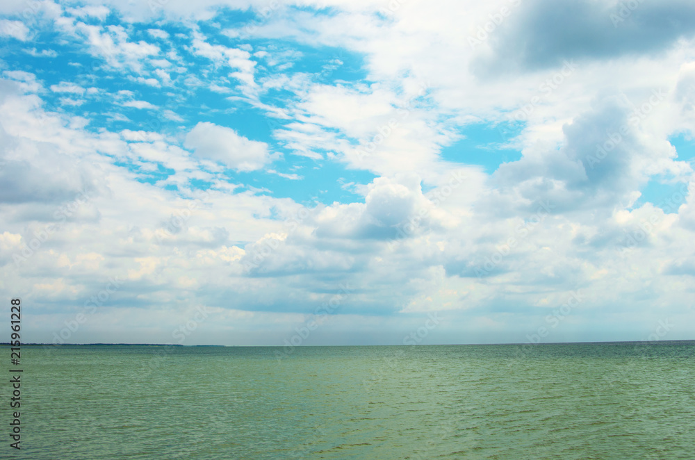 Sea landscape. Sea bank and cloudy sky