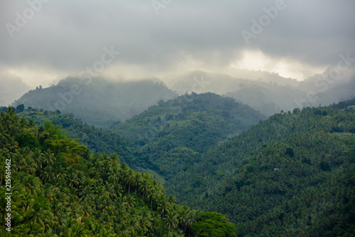 Clouds hanging over the mountains. Mountain landscape in cloudy weather. Mountain landscape in Asia, Philippines.