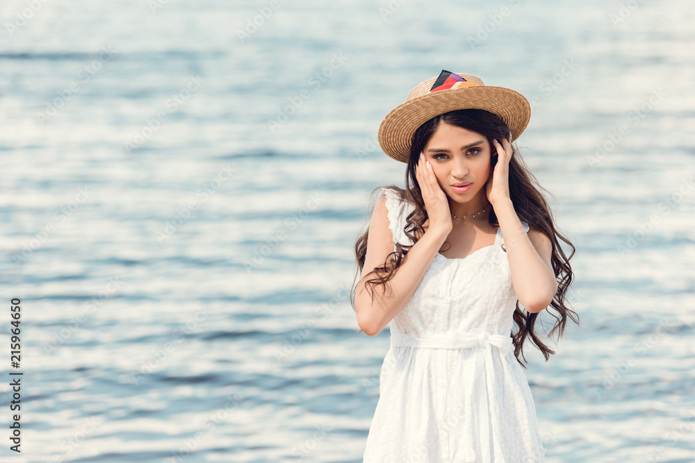 brunette brunette girl in straw hat on sea resort