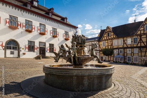 Fountain made of copper in the middle of the old marketplace with half-timbered houses in Linz am Rhein, Germany